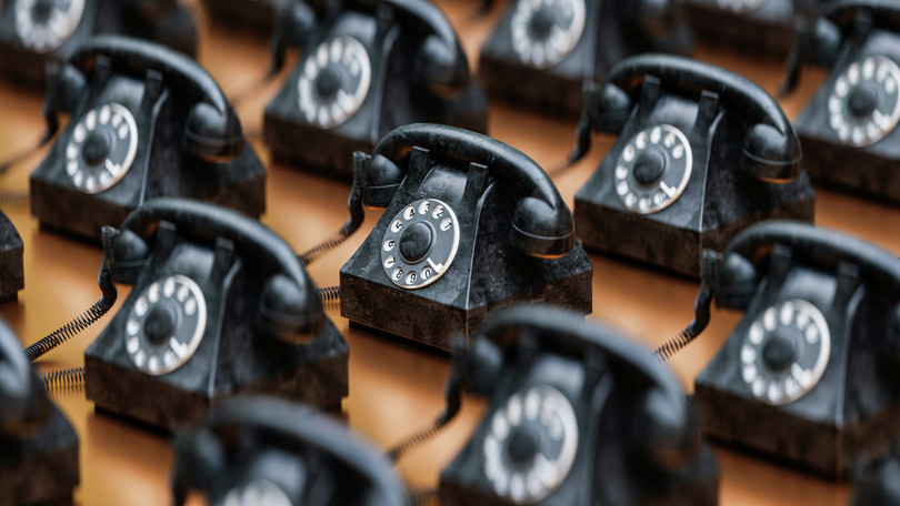 A group of black telephones.